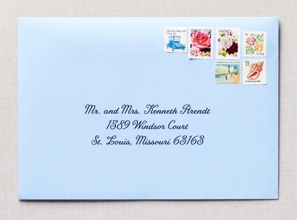blue envelope with stamps
